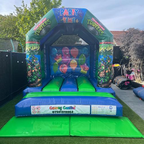 0 x 12 ft Small Blue and Green Ninja Turtles Bouncy Castle Hire Essex
