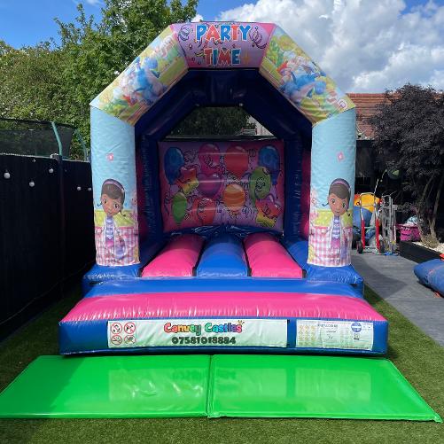 10 x 12 ft Small Pink and Blue Doc Mc Stuffins Bouncy Castle Hire Essex