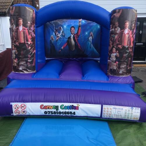 Small Blue and Purple Greatest Showman Bouncy Castle Hire Essex