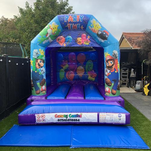 10 x 12 ft Small Purple and Blue Super Mario Bouncy Castle Hire Essex