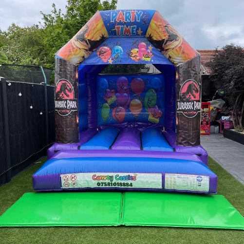 10 x 12 ft Small Blue and Purple Jurassic Park Bouncy Castle Hire Essex