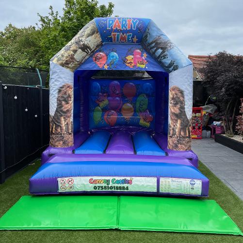 10 x 12 ft Small Blue and Purple Lion King Bouncy Castle Hire Essex