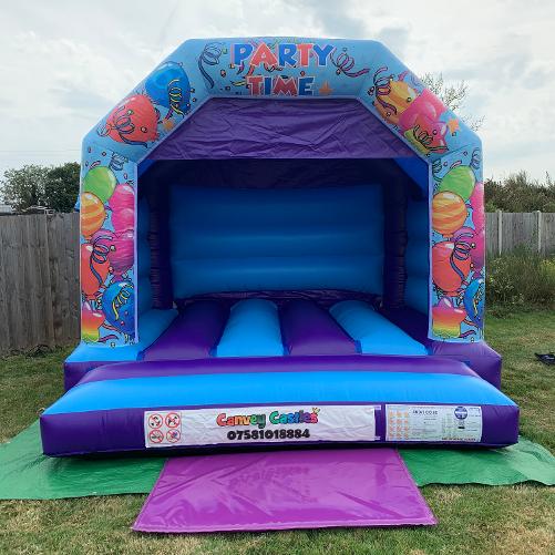 12 x 12ft Medium Light Blue and Party Time Bouncy Castle Hire In Essex
