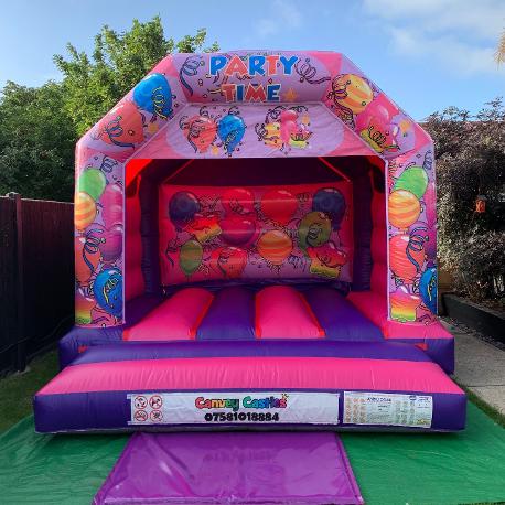 12 x 12ft Medium Pink and Purple Partytime Bouncy Castle Hire In Essex