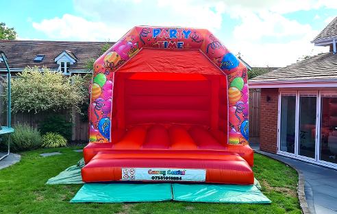 12 x 15ft Medium Red and Orange Partytime Bouncy Castle Hire In Essex